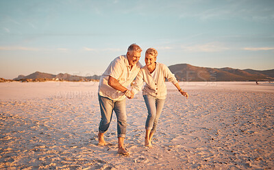 Buy stock photo Retirement, senior couple and love being on beach, sand and walking being happy, smile and relax together. Romantic, mature man and elderly woman on seaside vacation, holiday and bonding for romance.