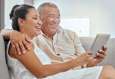 Buy stock photo Tablet, movie and senior couple streaming a film on the internet from the living room sofa of their house. Happy elderly man and woman on a subscription service website for a film with tech on couch
