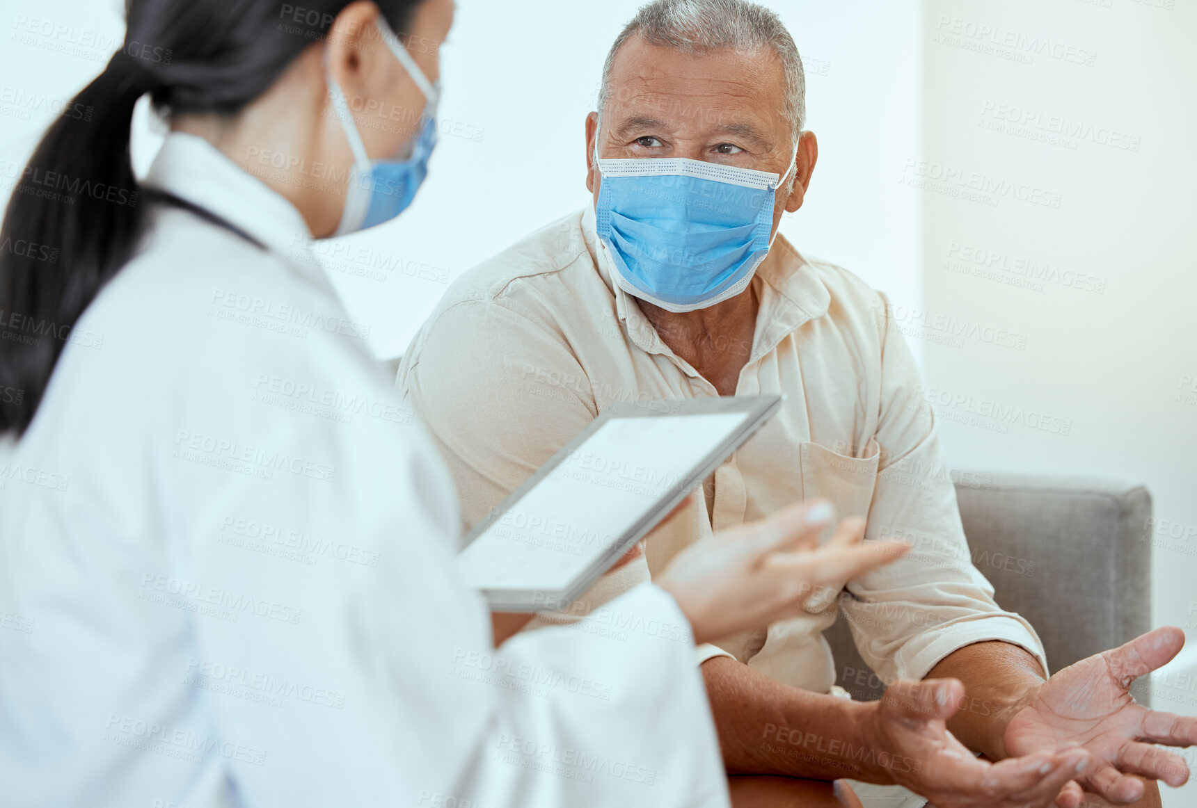 Buy stock photo Covid, senior patient and doctor with tablet, discussion for medical results and appointment in hospital. Mockup, medical professional and man with mask talk, speaking and consultation for healthcare