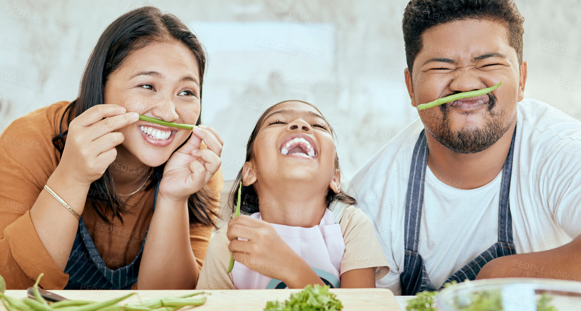 Buy stock photo Happy asian family, play vegetables kitchen in portrait and smile together at table for bonding time. Mom dad, child happiness in comic home and health food in nutrition diet, dinner and kid cooking
