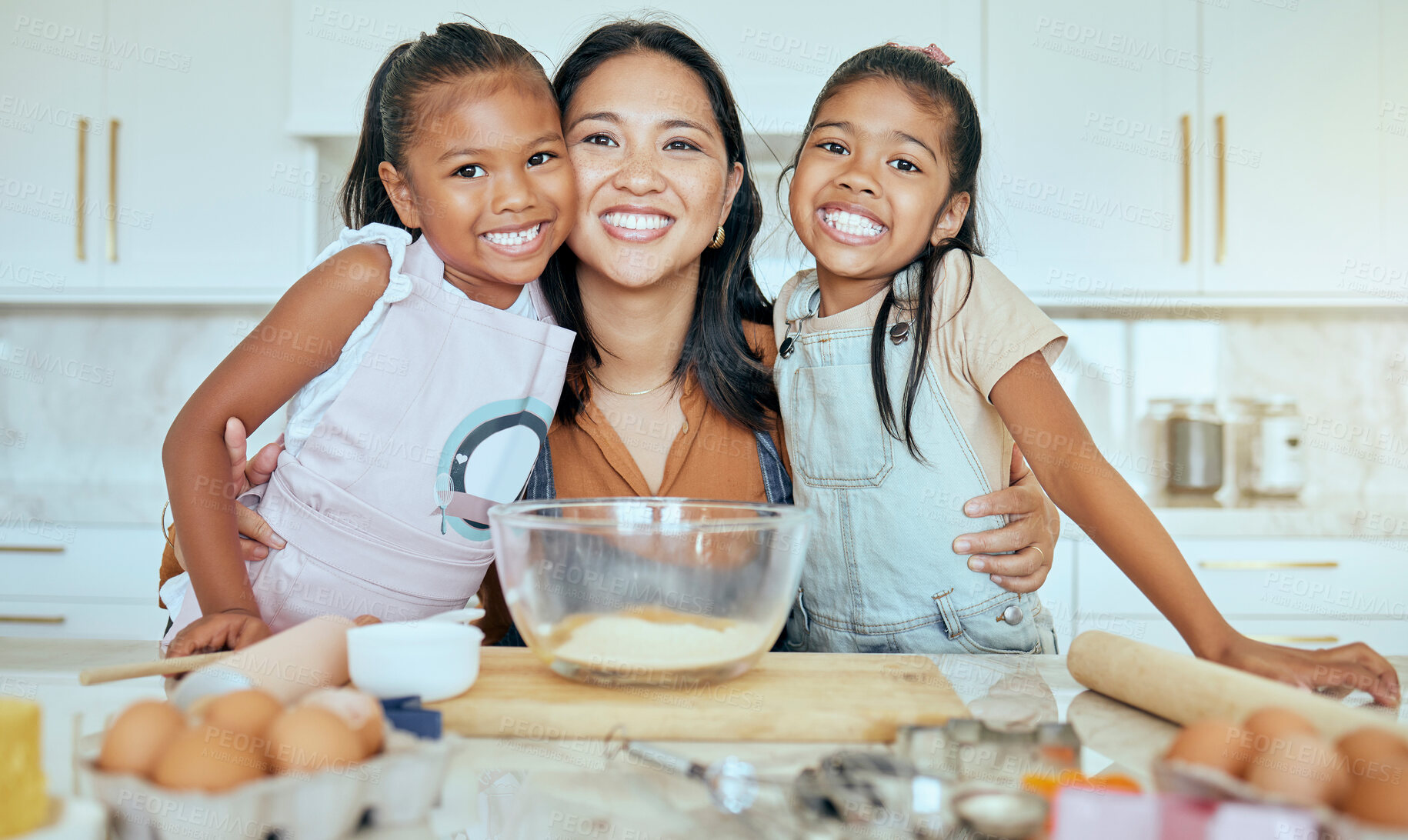 Buy stock photo Baking, mother and children in kitchen, happy and smile together, bonding and child development. Portrait, mama and girls learn skills, loving and child care for fun, joyful and daughter at home.