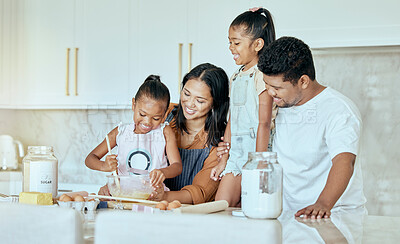Buy stock photo Happy, mother and father baking with children for family bonding, learning and teaching in the kitchen at home. Mama, dad and little girls helping parents with smile for mixing ingredients together