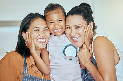 Buy stock photo Mother, grandmother and child in apron, hug and cooking  together in kitchen, smile in portrait, family and spending quality time. Filipino women hugging girl, happy and generations bonding at home.
