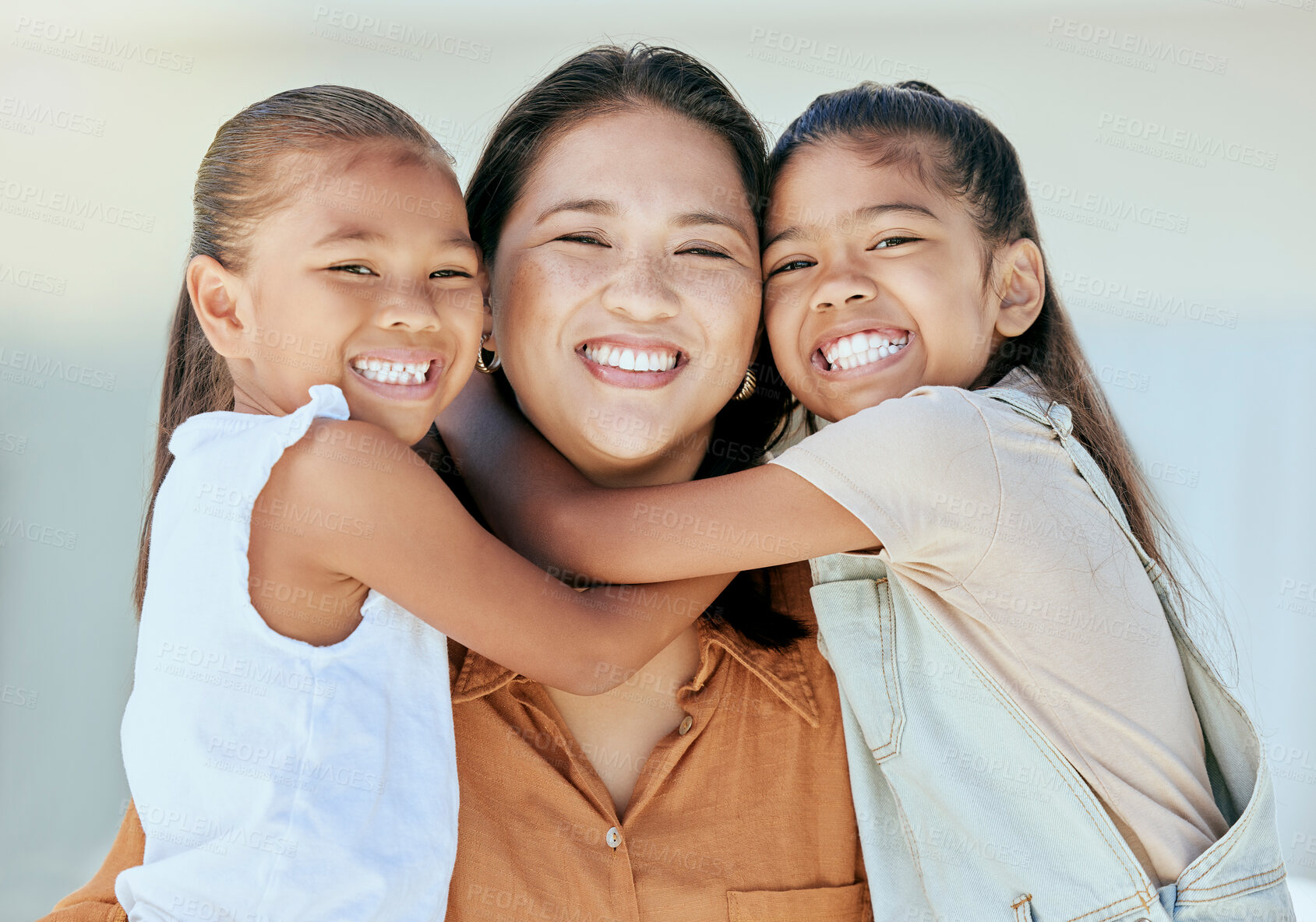 Buy stock photo Happy family, mother and girls hug in portrait, bonding and 
enjoying quality time together. Family, love and care of mom, woman and parent with kids, smiling and laughing, embrace and comic smile.