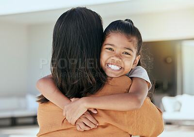 Buy stock photo Mom, girl and bonding hug in house living room or family home in mothers day celebration, birthday or security. Portrait, smile or happy child with woman or Indonesian parent in trust, safety or love