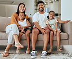 Portrait, happy family and relax on sofa together in holiday living room at home bonding. Married man, woman smile and young children love cheerful happiness freedom spend time in vacation apartment