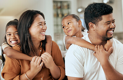 Buy stock photo Happy, smile and children hugging their parents while sitting together in the living room at home. Happiness, love and girl kids embracing their mother and father while bonding and relaxing at house.