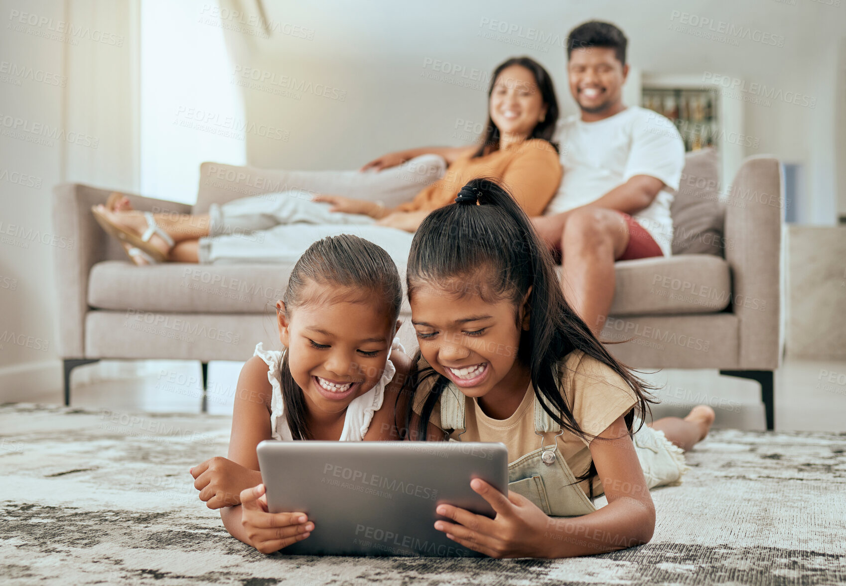 Buy stock photo Children, tablet or relax parents in living room of house or family home for education video, movie streaming or internet esports. Smile, happy or bonding kids on technology and watching man or woman