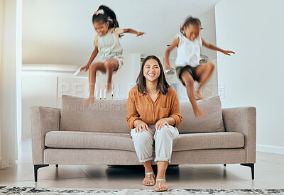 Buy stock photo Family, mom and kids jumping on sofa having fun, energetic and hyper at home. Happiness, joy and portrait of mother sitting with excited children jump on couch, play and relax together on weekend