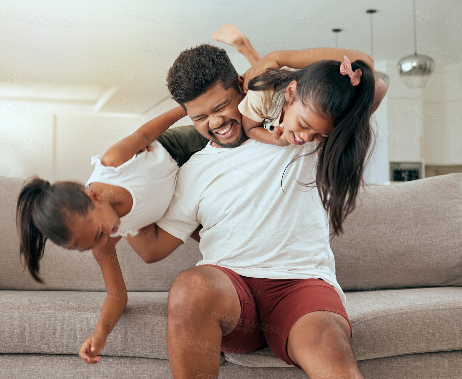 Buy stock photo Happy, father and girl children with fun family time in a home living room sofa with a smile. Kids play, dad and children happiness of people on a lounge house sofa bonding in a black family home