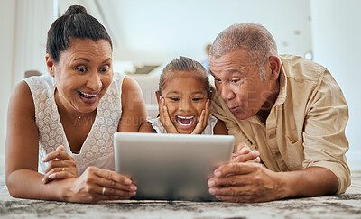 Buy stock photo Relax, digital tablet and family on floor in living room, wow and happy with online cartoon or animation in Mexico. Happy family, grandparents and girl bond, watch and enjoy internet fun together