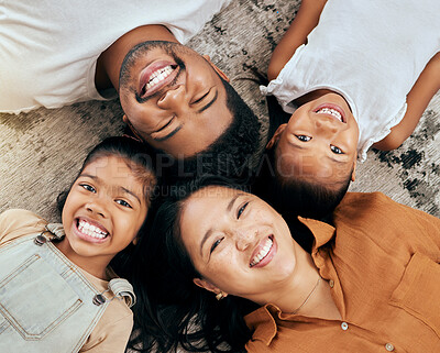 Buy stock photo Happy, family and face above on the floor in happiness for bonding time or relaxing together at home. Portrait of mother, father and children faces with big smile for holiday break at the house