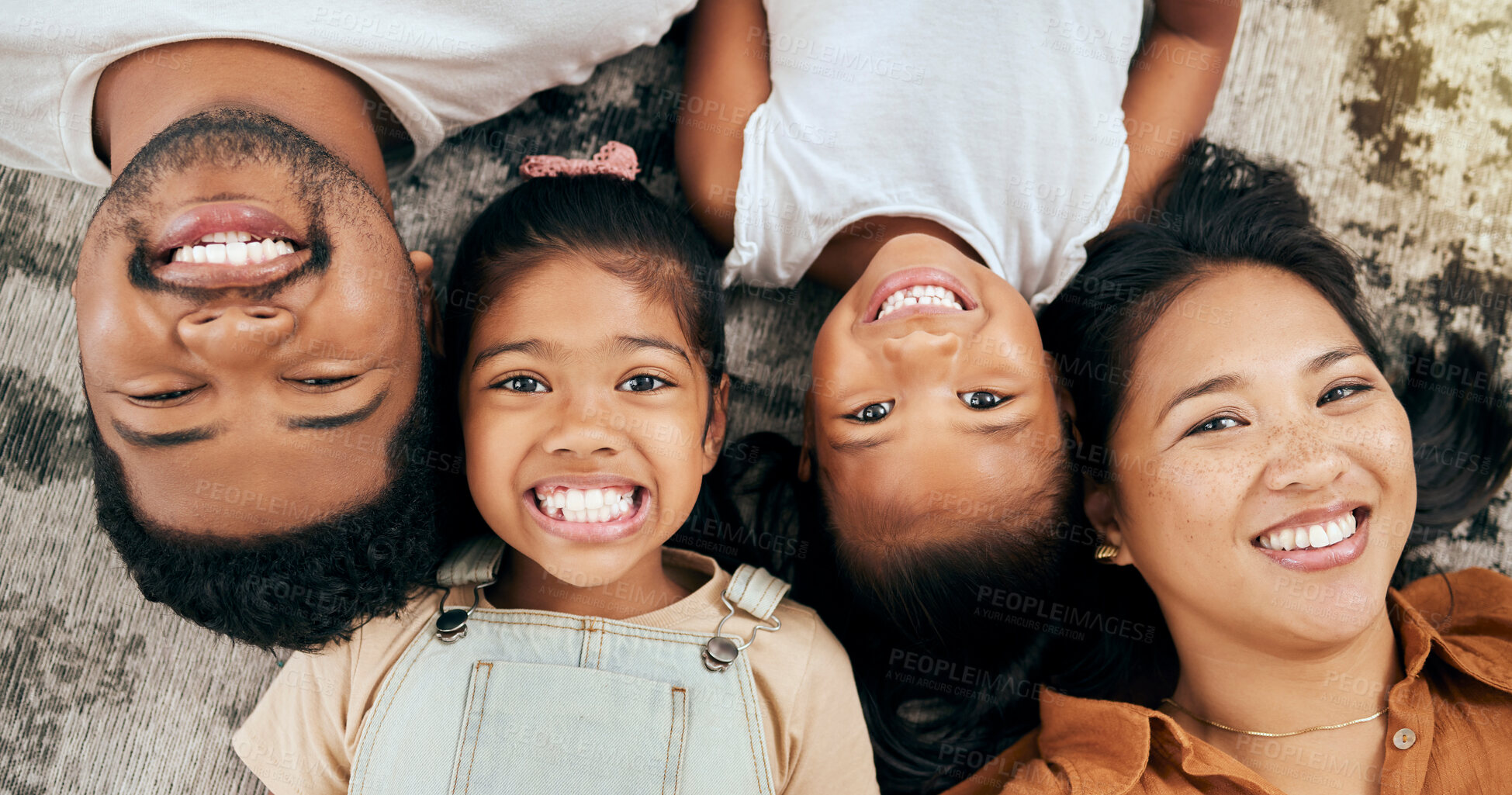 Buy stock photo Happy, smile and portrait of family on floor with top view for care, wellness and bonding in living room. Relax, youth and lifestyle with parents and children lying on ground of home for support