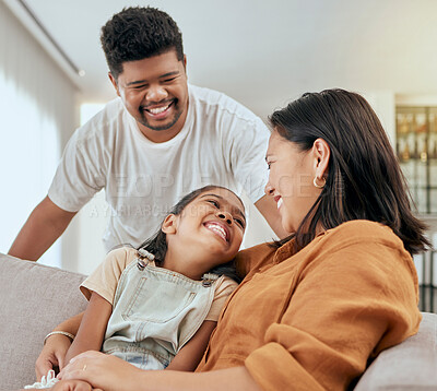 Buy stock photo Family, mother and daughter hug with father standing at lounge sofa in Philippines home. Love, care and affection embrace of filipino mom bonding with happy child on couch in living room.