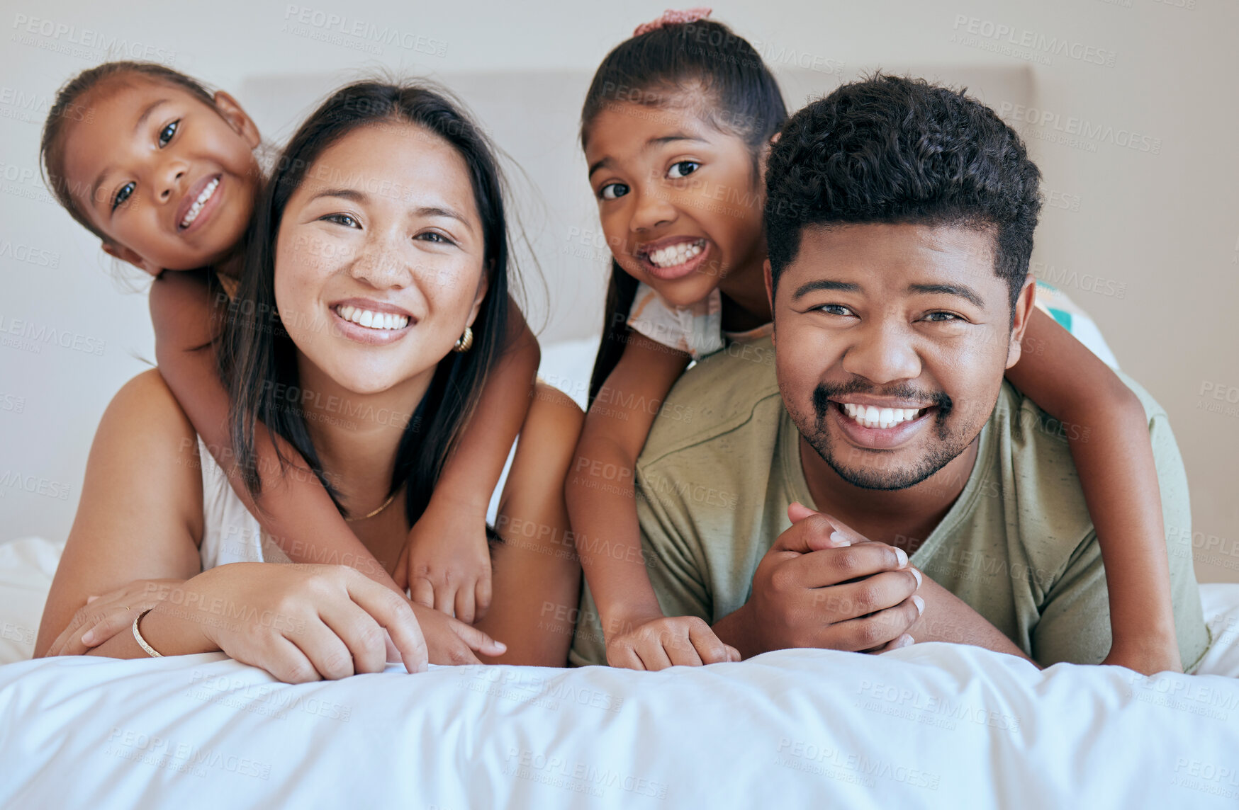 Buy stock photo Happy family, bed and girl with mother, father and sister in a bedroom for fun, bond and rest together. Face, portrait and mexican family hug, smile and happy with kids and parents embrace in Mexico