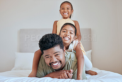 Buy stock photo Family, children and bed with a man, daughter and sister having fun together in their home while bonding. Bedroom, love and playful with a father and daughter siblings laughing or joking in a house