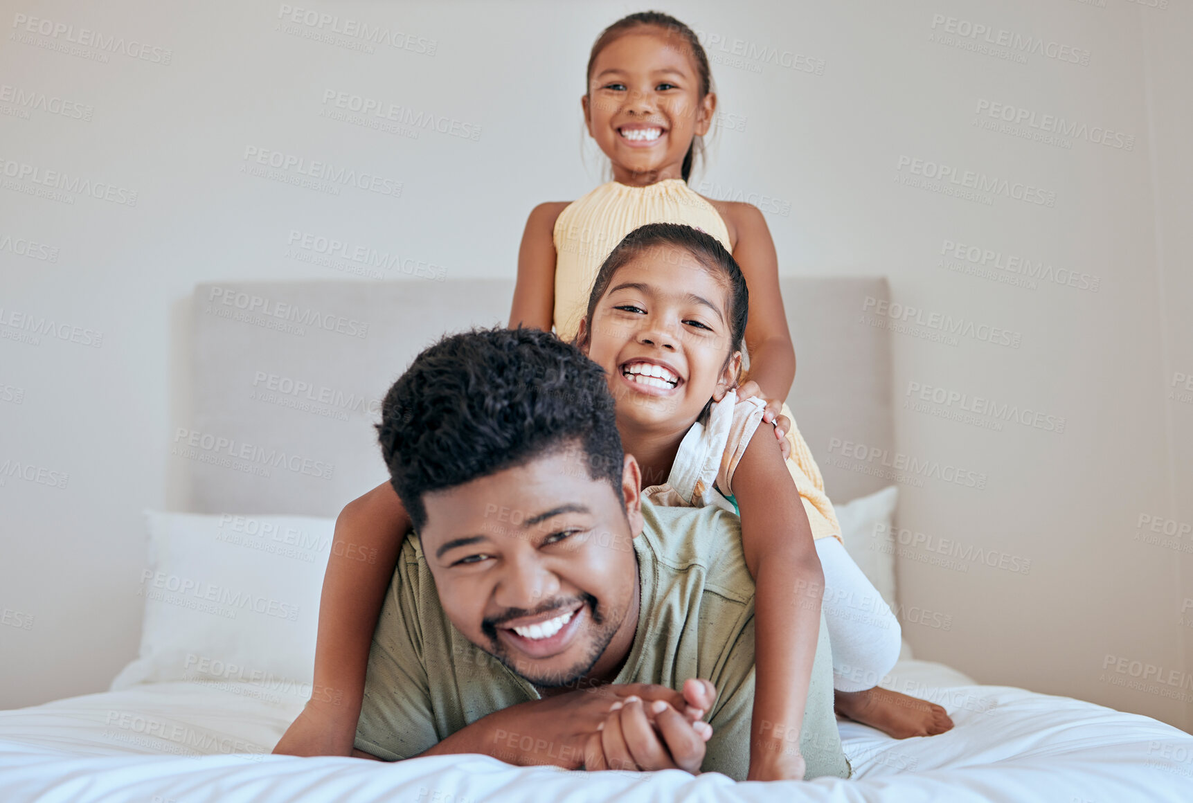 Buy stock photo Family, children and bed with a man, daughter and sister having fun together in their home while bonding. Bedroom, love and playful with a father and daughter siblings laughing or joking in a house
