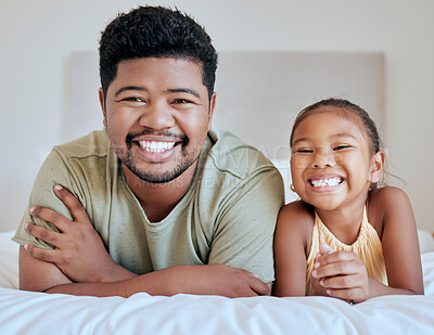 Buy stock photo Asian, dad and girl on bed, lying and together with smile, happy and portrait in bedroom in house. Father, child and happiness in room for bonding and care while relax in family home in Jakarta