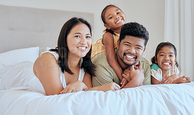 Buy stock photo Happy, asian and family bedroom portrait together with smile, children and care in loving home. Happiness, relax and mother with father on bed for rest, bonding and leisure with young children.

