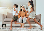 Child care stress, mother and children running with energy with mom feeling anxiety on a home sofa. Mama burnout, kids and fast siblings run in the living room lounge with mom stress on the couch