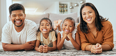 Buy stock photo Happy family, relax and portrait on home carpet with young and cheerful filipino children. Daughter, mother and father smile on floor together with happy kids in Philippines family home.

