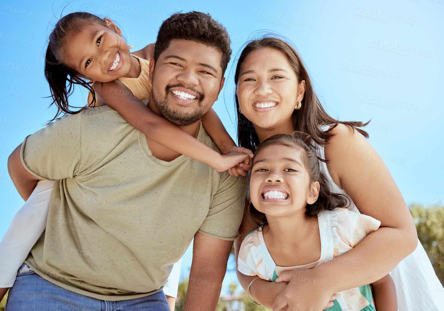 Buy stock photo Black family, smile and outdoor quality time together of a mom, dad and girl children. Happy portrait of a father, mother and kids having fun bonding with a piggy back and happiness in nature