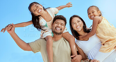 Buy stock photo Happy family, couple with girl children and blue sky on outdoor summer vacation in Asia. Happy Asian mother, father and kids with piggy back fun playing in the sun and spending quality time together.