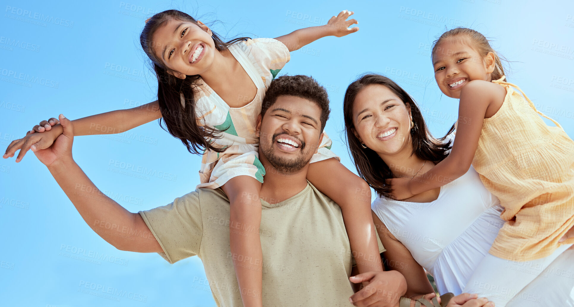 Buy stock photo Happy family, couple with girl children and blue sky on outdoor summer vacation in Asia. Happy Asian mother, father and kids with piggy back fun playing in the sun and spending quality time together.