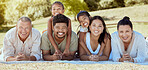 Relax, nature and big family on a happy picnic to enjoy quality time, bonding and summer holidays vacation. Grandparents, mother and father with children siblings smile together in a group portrait