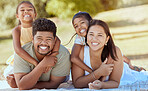 Happy family, hug and portrait smile for relax, quality bonding time or summer vacation together in the outdoors. Mother, father and children smiling in happiness for freedom, relationship and nature