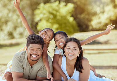 Buy stock photo Happy family, portrait and relax in a park in summer, happy and playing, smile and bonding while lying in grass together. Family, rest and kids enjoy quality time with parents, excited and cheerful