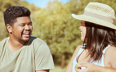 Buy stock photo Happy, love and couple in nature in a conversation while on an outdoor garden picnic date in summer. Happiness, communication and young man and woman with a smile talking in a park to relax together.