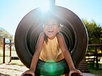 Child, smile and park on jungle gym, tyre and playing in sunshine, summer and outdoor while excited. Happy, girl and wow for laugh, happiness and playground in lens flare, comic and nature in Orlando