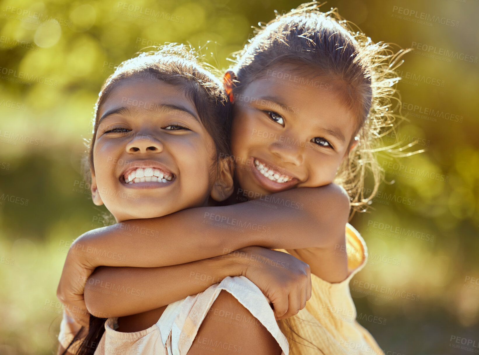 Buy stock photo Girl, hug and love, sisters and happy in portrait together, young kids outdoor and family bonding in nature. Indian children smile, sibling relationship and care, spending quality time in park.