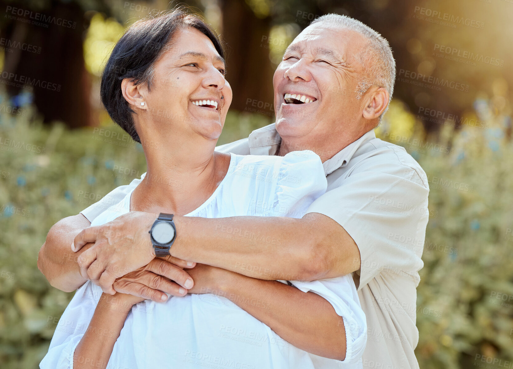 Buy stock photo Happy, couple and hug outdoor together with love, care and bonding while laughing. Marriage, retirement and quality time with happiness of senior people hugging in summer smile about life gratitude