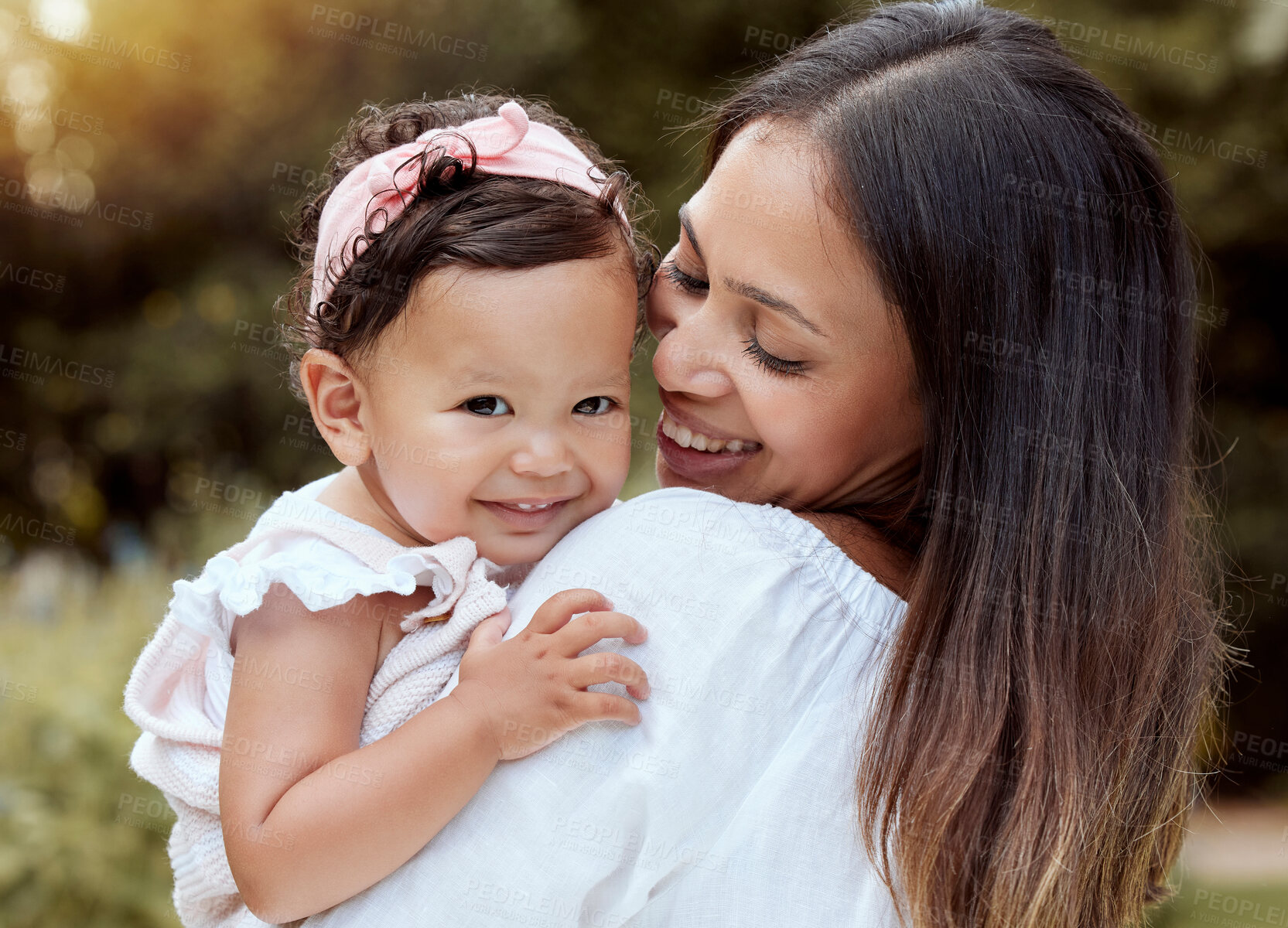 Buy stock photo Happy mother with girl baby hug in a park with summer love, smile and care or growth development wellness. Happy latino mom with kid in portrait together nature outdoor for mothers day with happiness