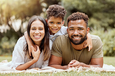 Buy stock photo Relax, picnic and happy with portrait of family in park for nature, smile and summer together. Spring, growth and wellness with mother and father hug with child in grass field for peace and health