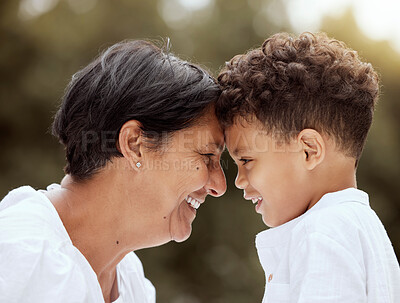 Buy stock photo Love, family and grandmother with grandchild at park, relax and smile while bonding in nature together. Happy, smile and face of senior woman bonding bond, embrace and laugh with sweet boy in forest