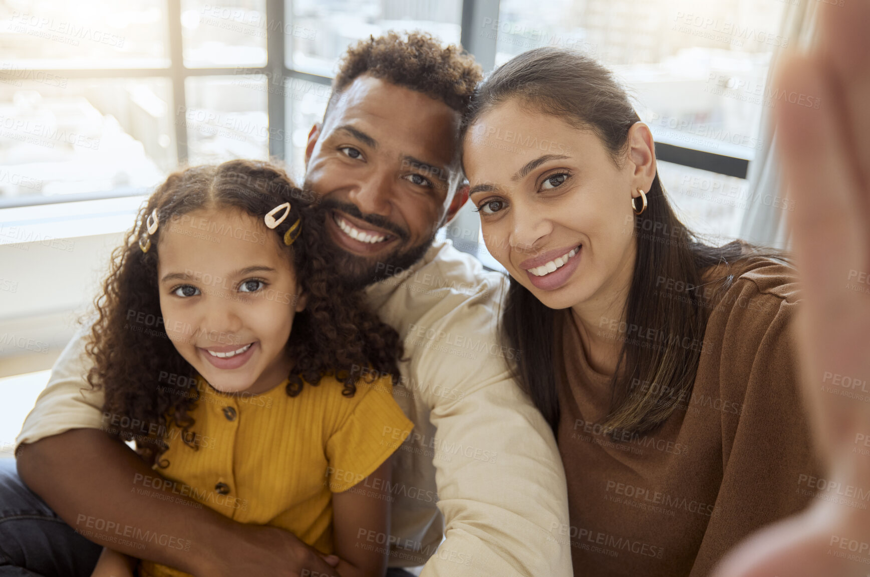 Buy stock photo Black family, selfie and happiness of a mother, father and girl bonding together at home. Portrait of a happy mama, dad and child with quality time, parents love and a hug showing care at a house