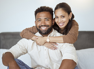 Buy stock photo Couple, smile and sofa for portrait with back, woman or love in living room while home together. Black woman, man and happy for embrace, care or hug on couch with happiness, face or bonding in lounge