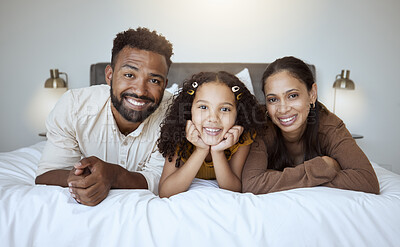 Buy stock photo Black family bed, bonding and love of a mother, father and girl on a home bedroom together. Portrait of a happy mama, dad and child in the morning feeling happiness smile feeling care in a house