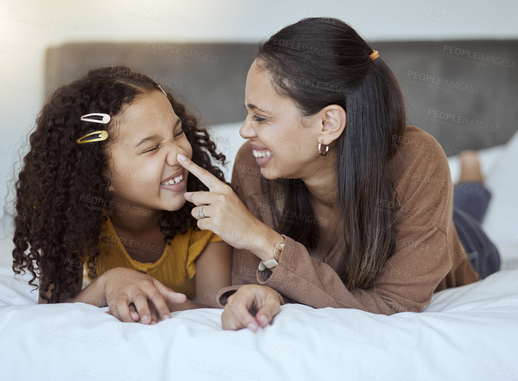 Buy stock photo Mother, girl and bonding on a home bedroom bed feeling happy, silly and family care. Mama and child spending quality time together with happiness in the morning in a house feeling comic and funny