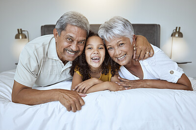 Buy stock photo Girl, grandparents and relax on bed with smile, happy and love with family bonding together in home. Portrait on latino child, senior man and woman laugh, joy and fun together in bedroom on a weeknd