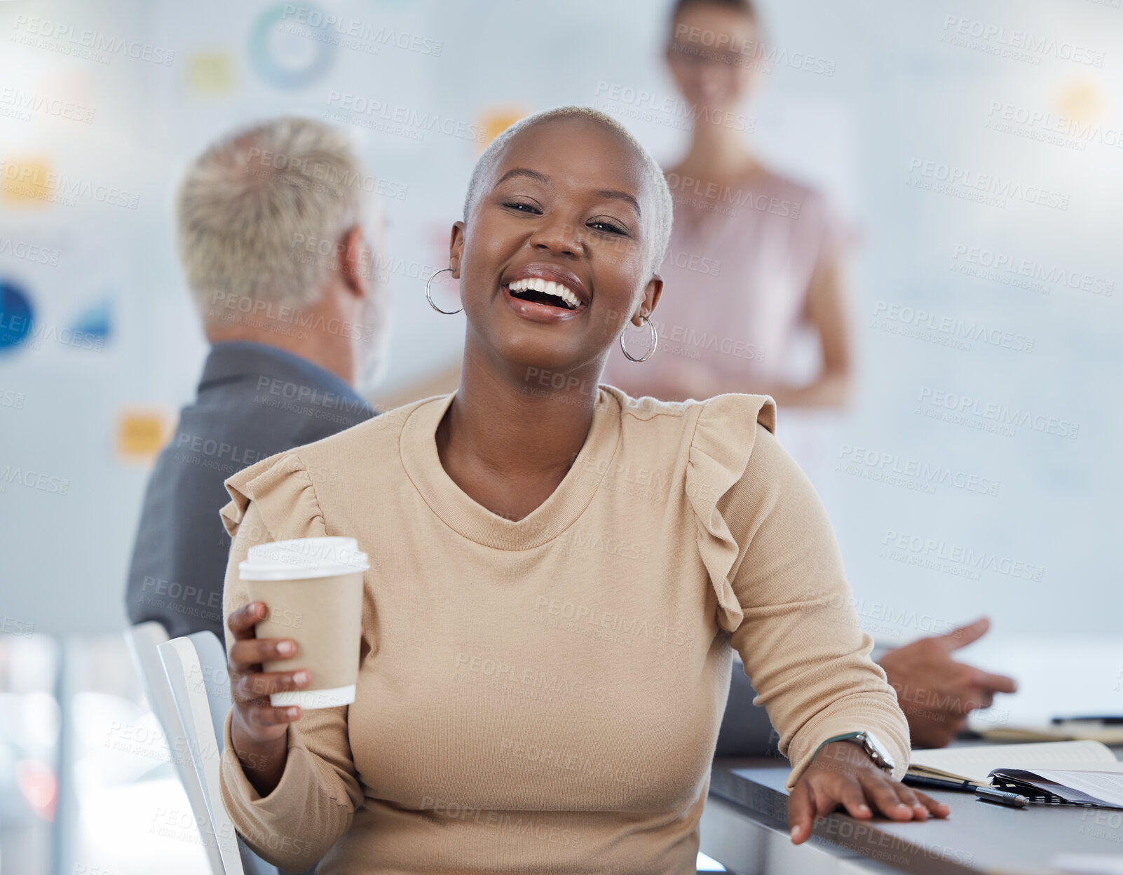 Buy stock photo Black woman, coffee and laughing office employee in a team meeting feeling happy about work. Portrait of a working bald worker from New York feeling happiness hearing a funny joke at advertising job