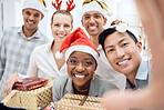 Selfie, Christmas and employees with gift at a party, celebration and smile in office together at work. Portrait of young, happy and team of business workers with present and photo at corporate event
