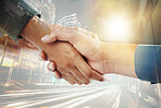 Business people, shaking hands and city overlay, welcome and thank you of people in collaboration. Double exposure, success and b2b partnership handshake, teamwork or trust, deal or crm agreement.
