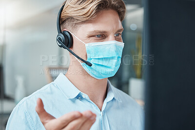 Buy stock photo Call center, face mask and telemarketing agent talking on headset for customer service and support inside crm office. Contact us advisor or sales man consulting online using pc during covid outbreak