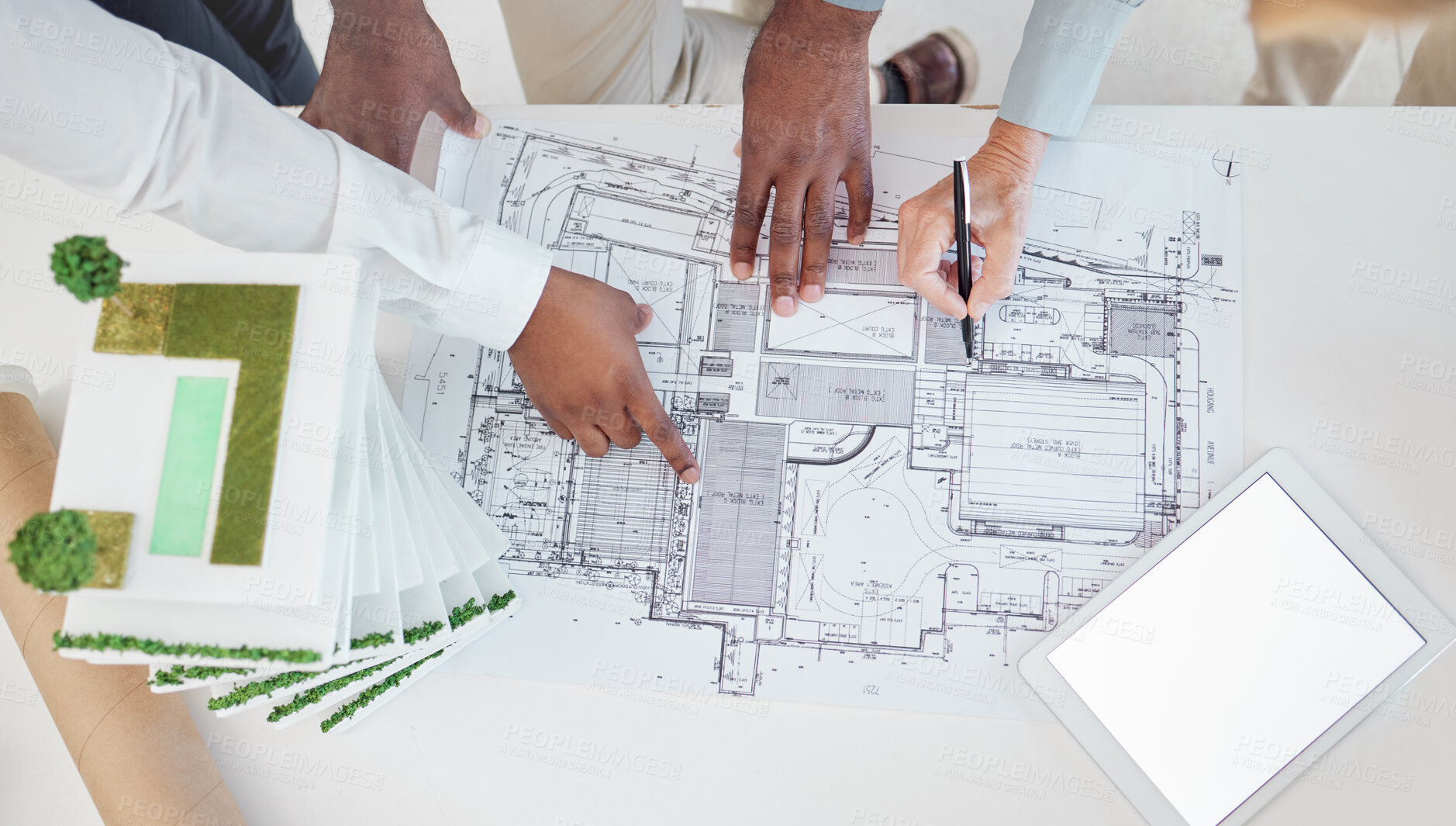 Buy stock photo Top view, teamwork and architects hands on blueprint, model or building, architecture or construction project. Team, engineers and group planning development project, design sketch and tablet mockup

