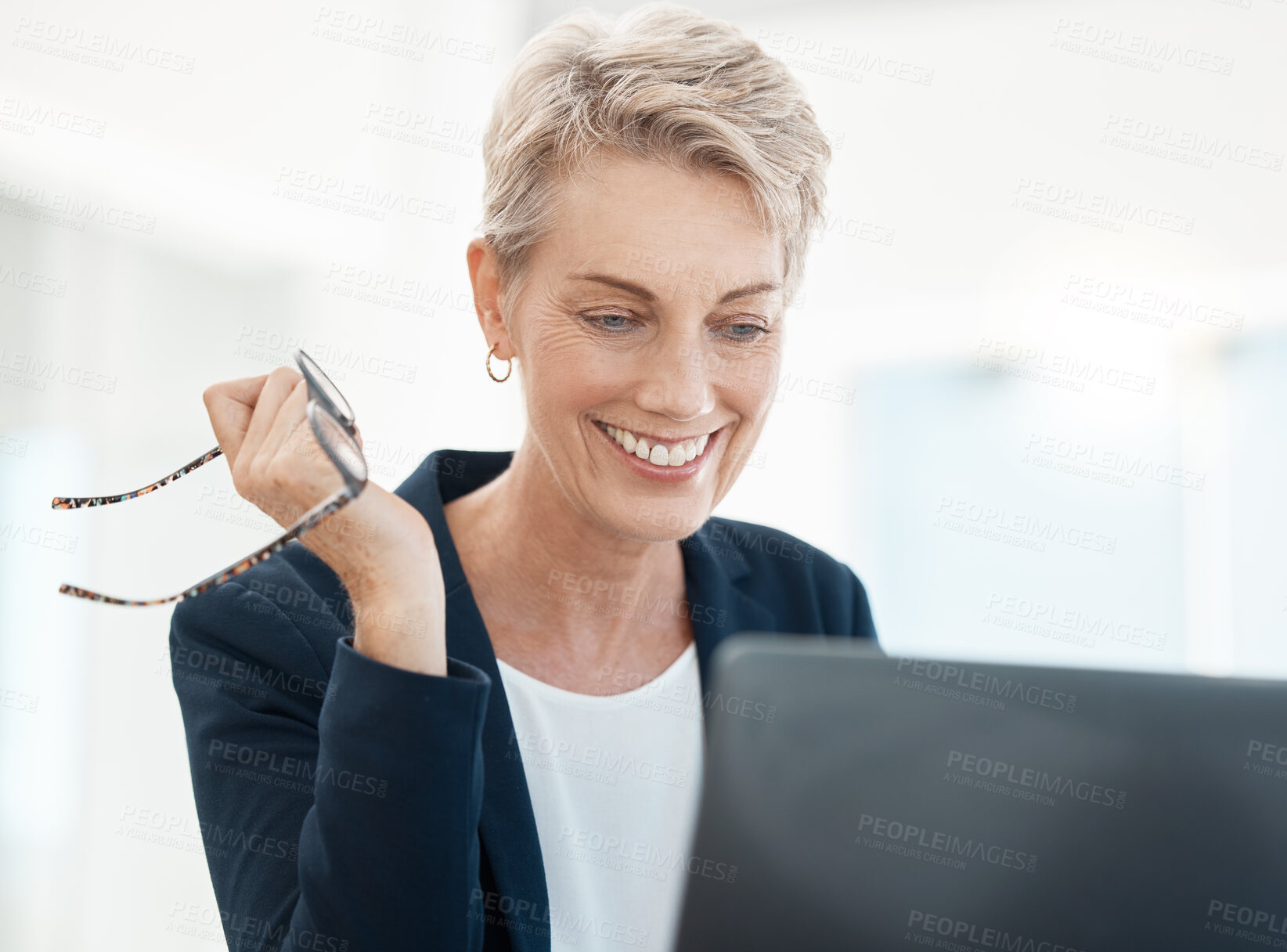 Buy stock photo Senior, executive and woman on laptop video call with client for friendly legal advice and talk. Mature lawyer lady with joyful smile online for professional communication holding glasses.

