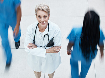 Buy stock photo Portrait, happy and doctor in busy hospital standing with crossed arms after consultation. Happiness, medicine and senior healthcare professional with stethoscope working in medical clinic in Canada.
